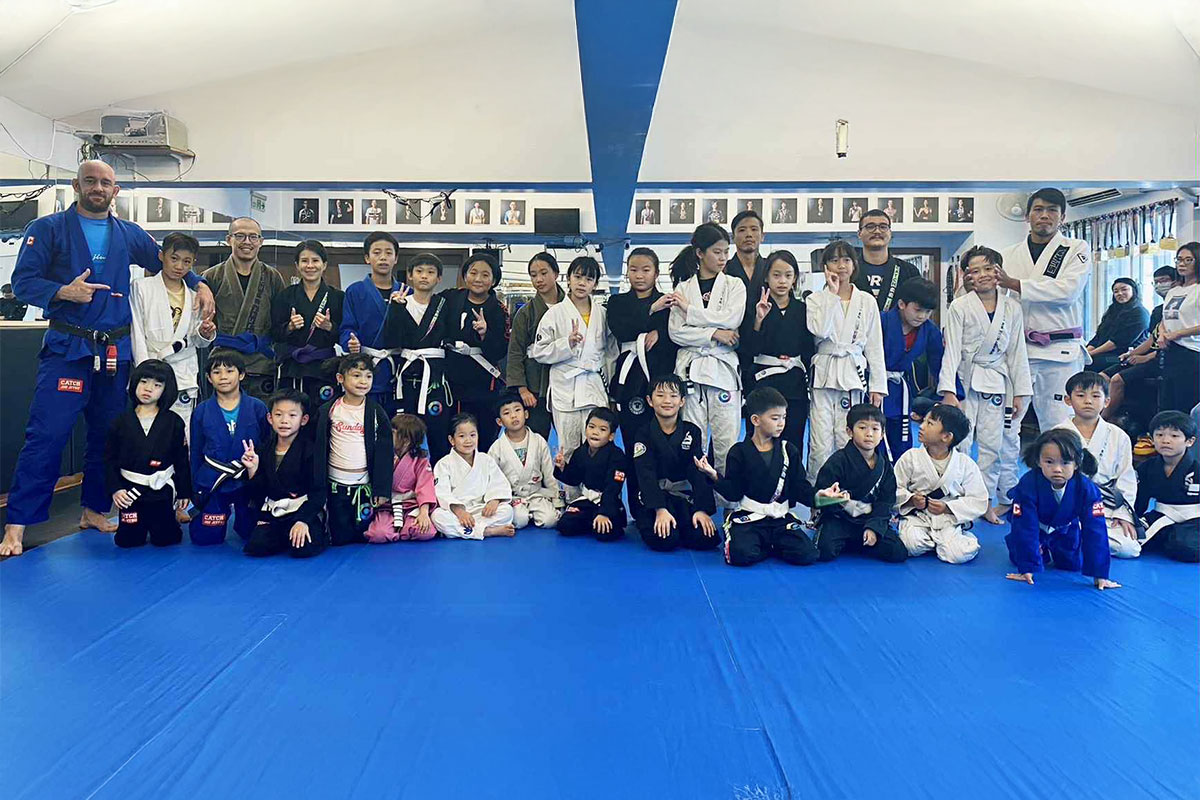 Junior BJJ students partnering in grappling drills — Catch Jiu Jitsu
